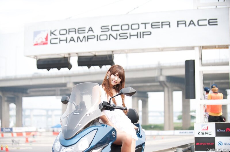 Woman on scooter at race event