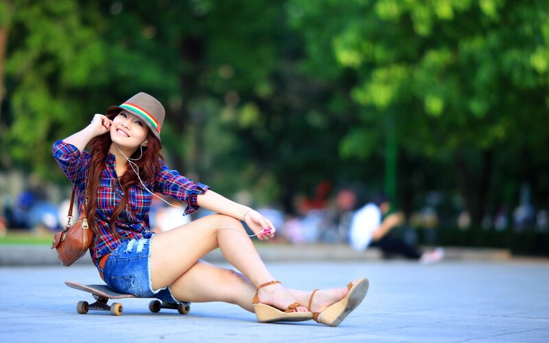 Woman on skateboard in park