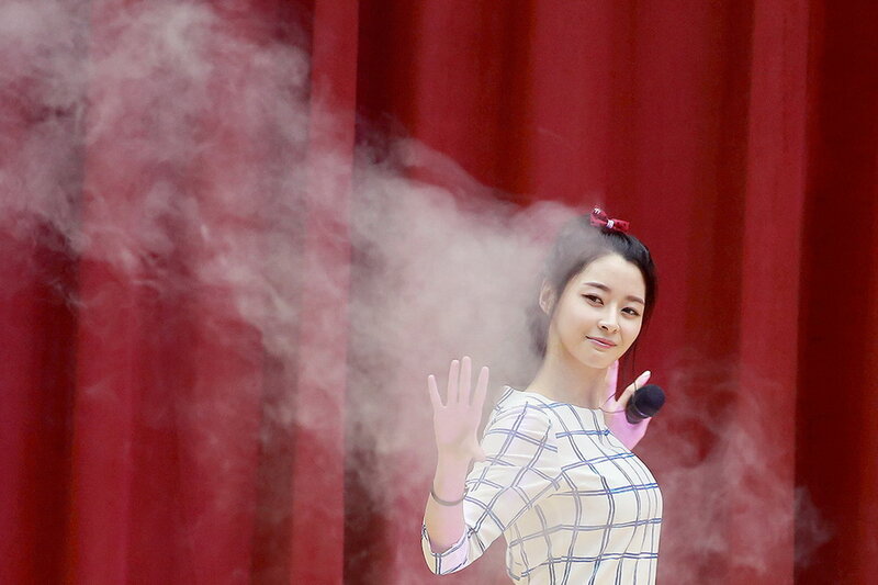 Woman on Stage Waving