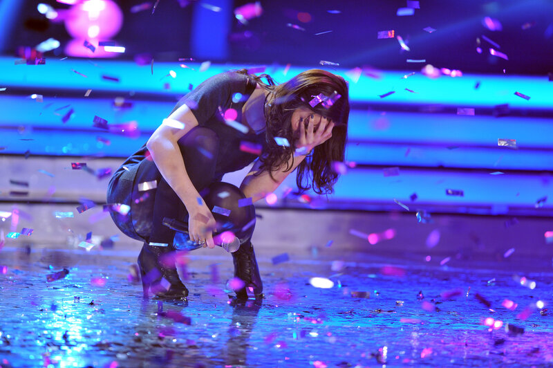 Woman on stage with confetti
