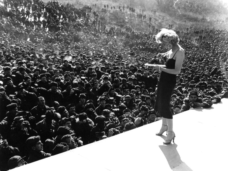 Woman on Stage with Crowd