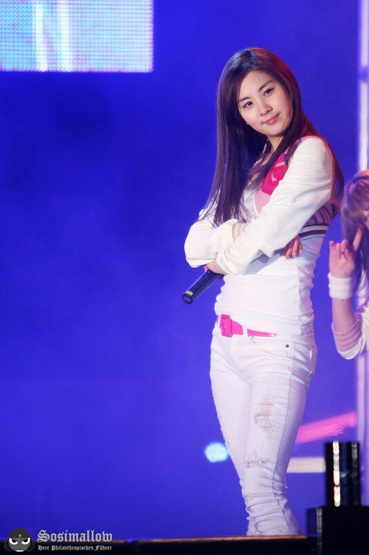 woman on stage with microphone