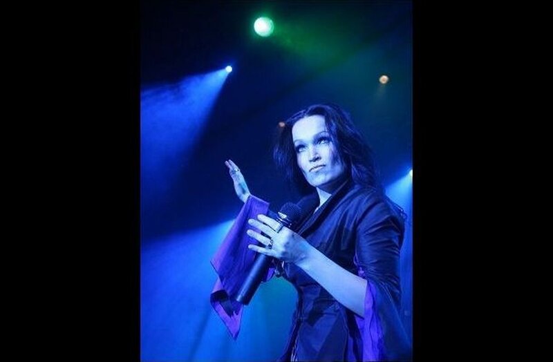 Woman on Stage with Microphone — Blue