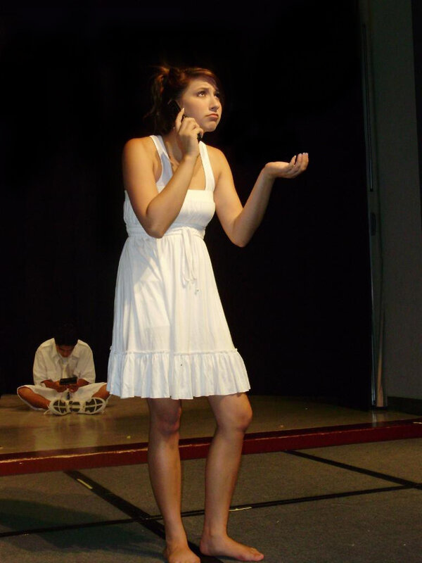 Woman on stage with phone