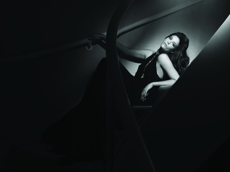 woman on staircase in black and white