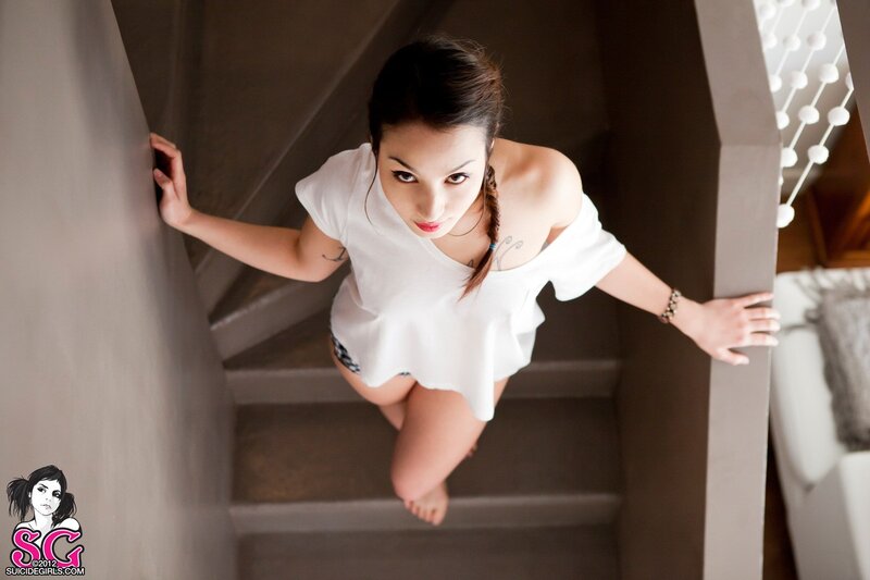 woman on staircase looking up
