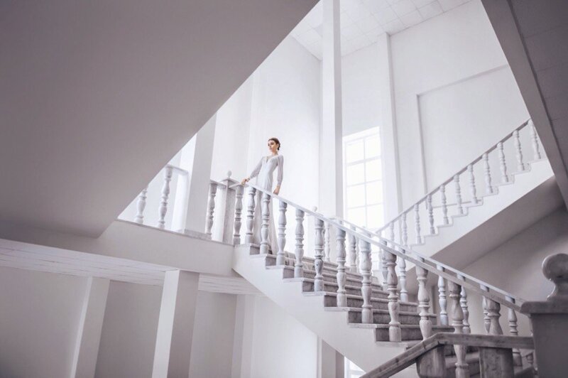 Woman on Staircase — White, Serene