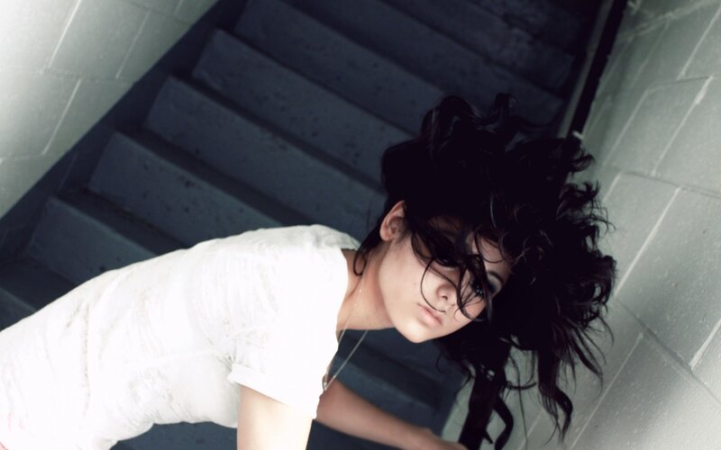 woman on stairs looking up