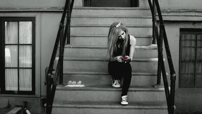 woman on steps with phone