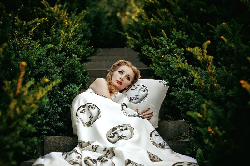 Woman on Steps with Pillows