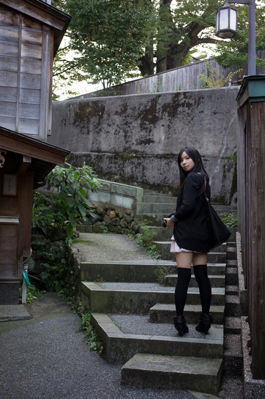 Woman on stone steps in Japan