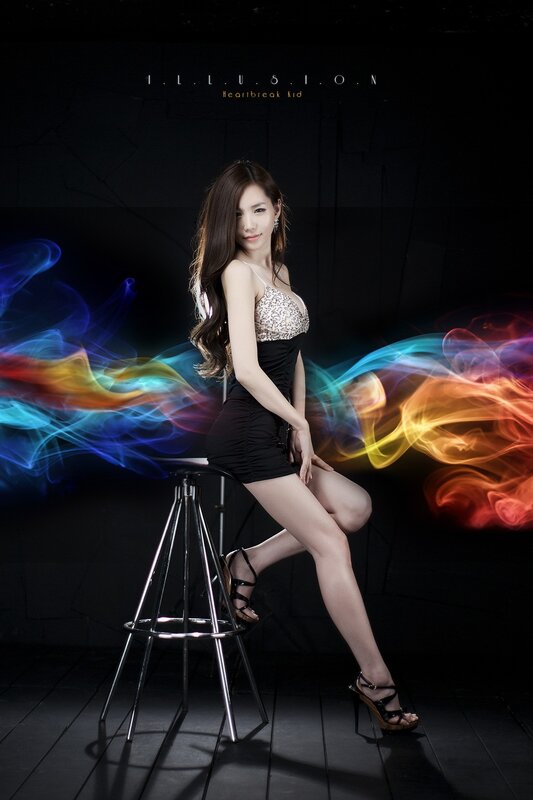 woman on stool with colorful smoke