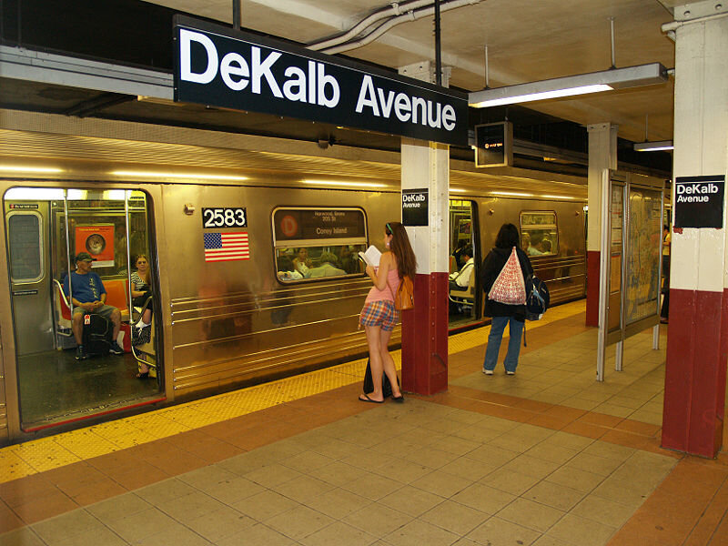 Woman on Subway Platform — Yellow