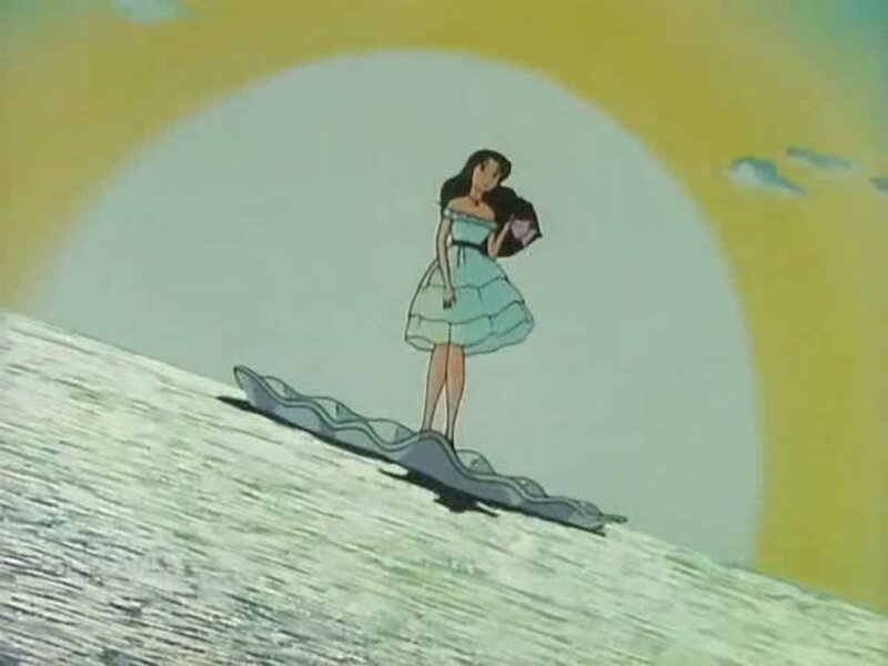 woman on surfboard at sunset