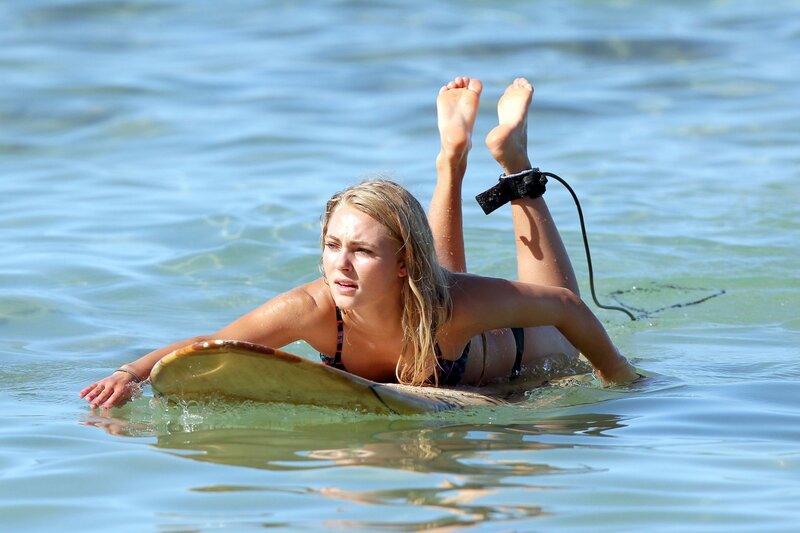 Woman on surfboard in ocean