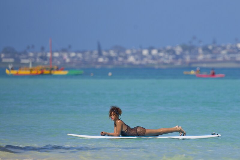 Woman on surfboard in ocean