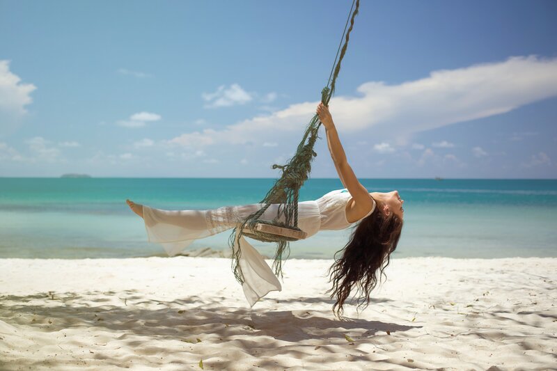 Woman on Swing at Beach — Blue