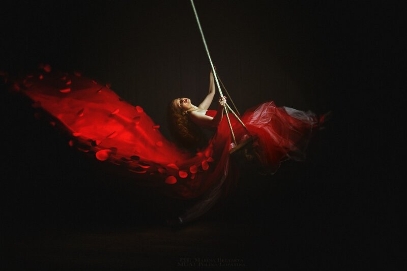 Woman on Swing in Red Dress