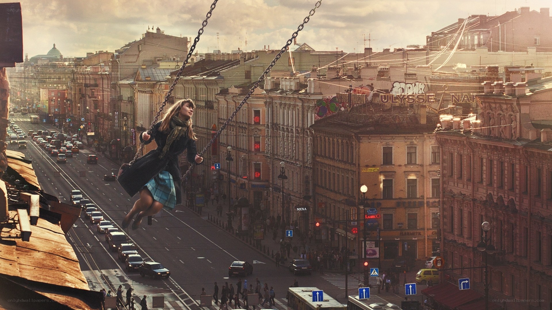 Woman on swing over city