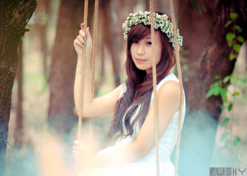 woman on swing with flower crown