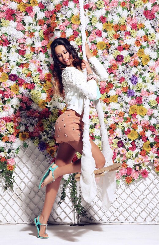 woman on swing with flowers