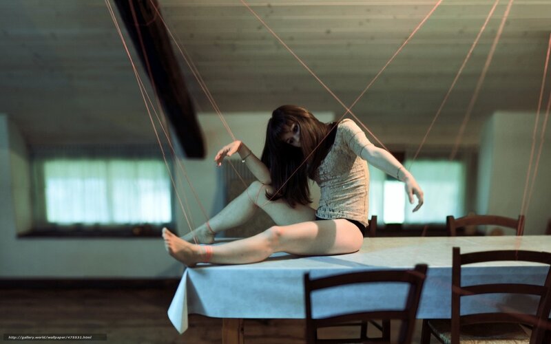 woman on table with strings