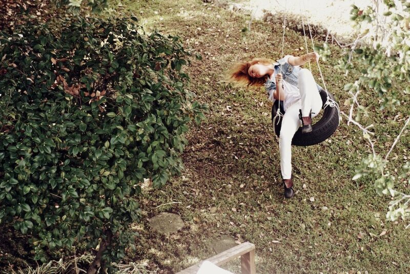 Woman on tire swing