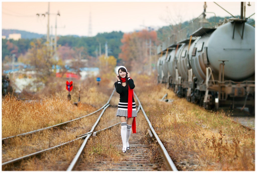 Woman on train tracks