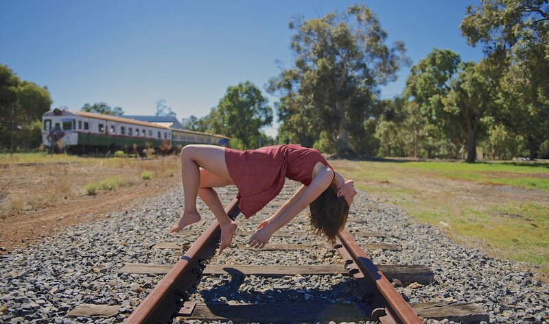 Woman on train tracks