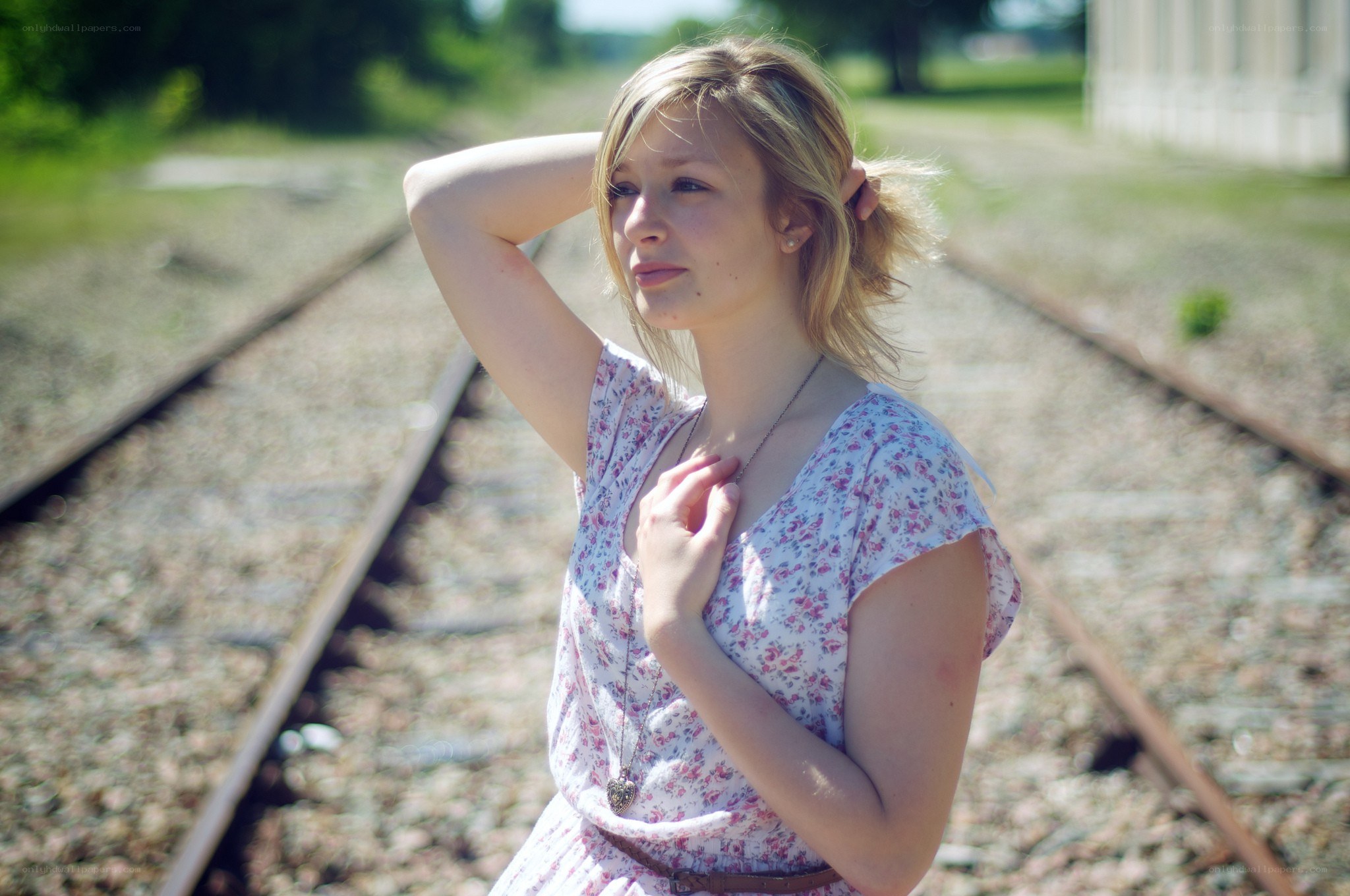 Woman on train tracks