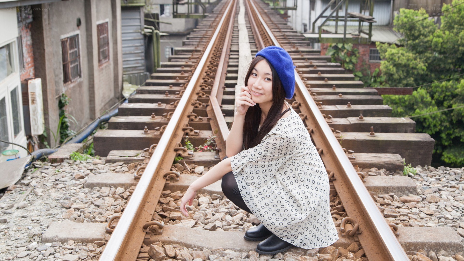 Woman on train tracks