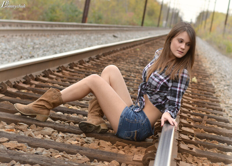 Woman on Train Tracks — Brown, Contemplative