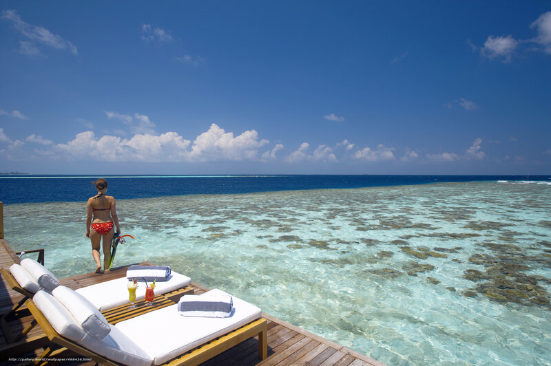 Woman on tropical beach deck