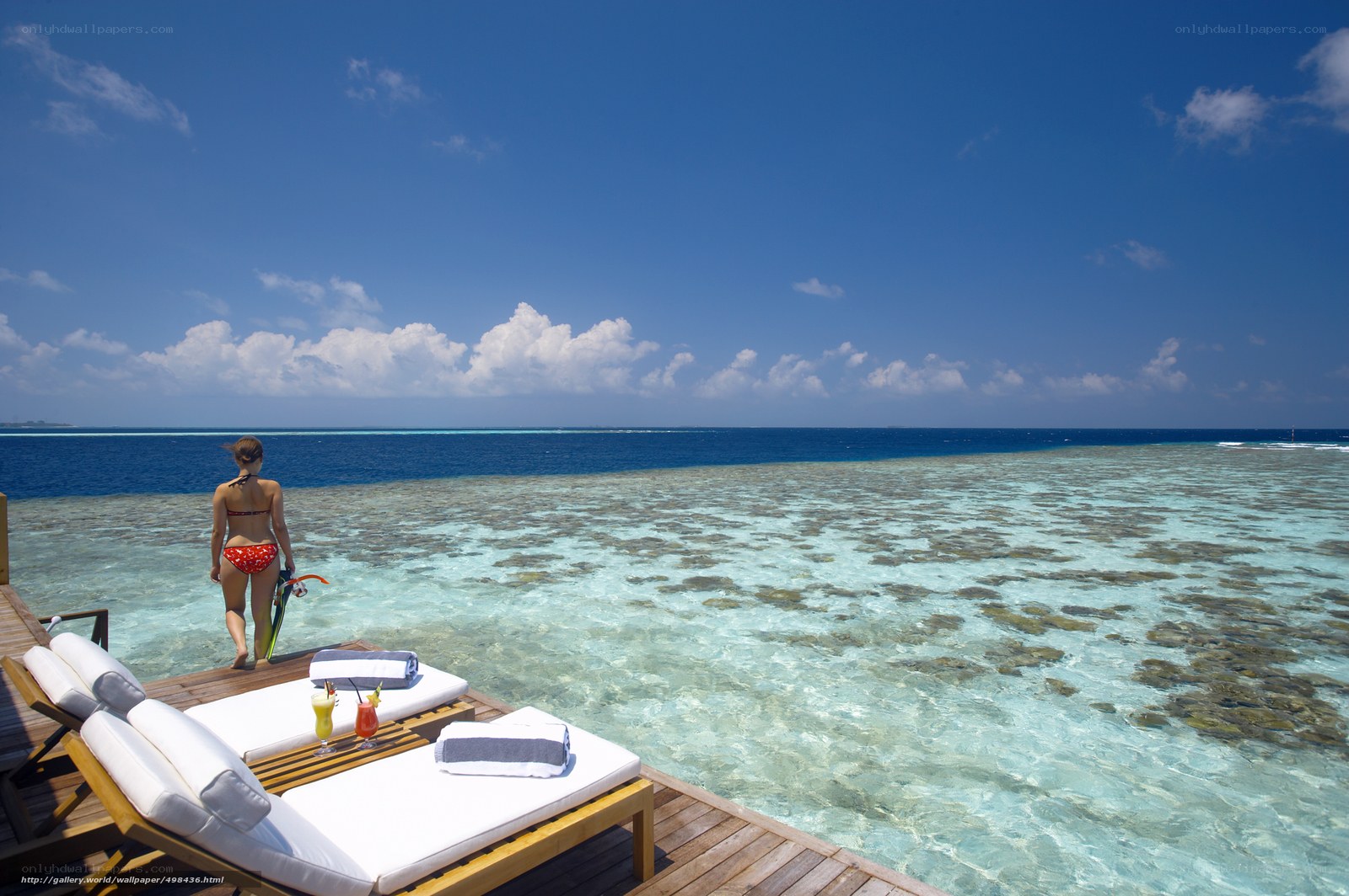 Woman on tropical beach deck