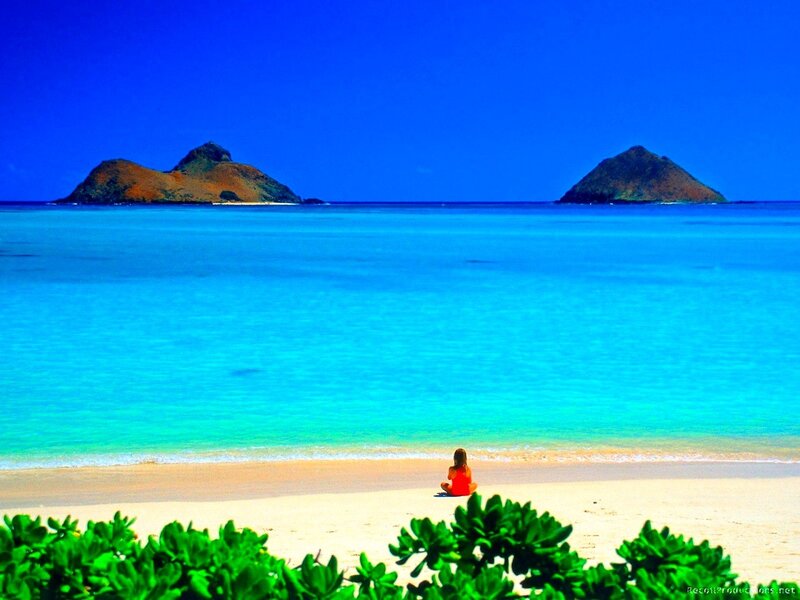Woman on tropical beach with islands