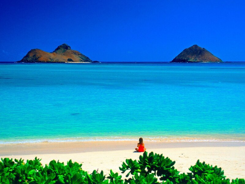Woman on tropical beach with islands