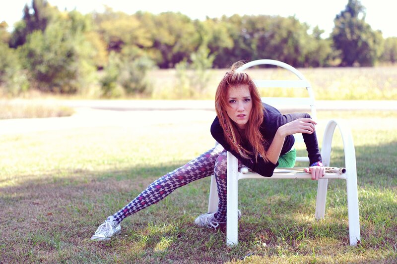 Woman on white bench outdoors