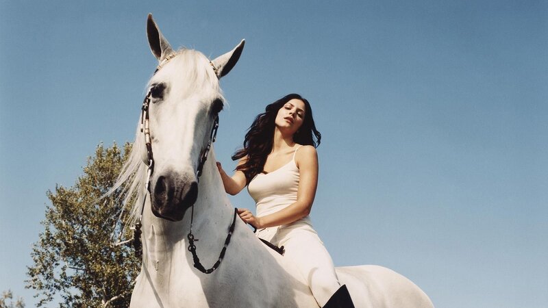 woman on white horse