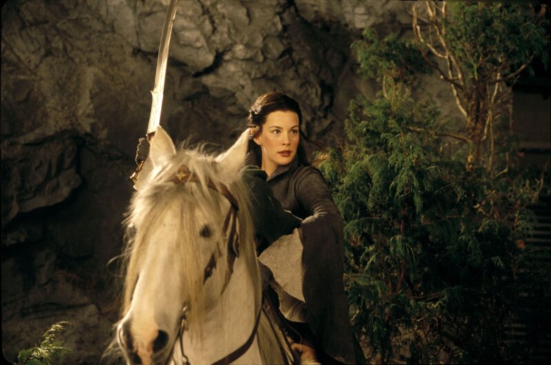 Woman on white horse with sword