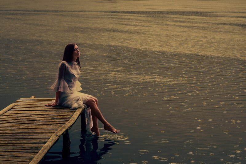 Woman on Wooden Dock — Brown