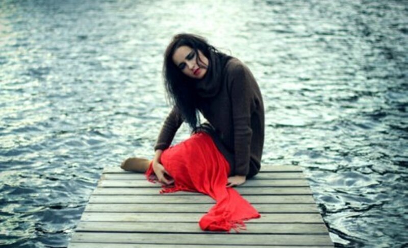 Woman on Wooden Dock — Red