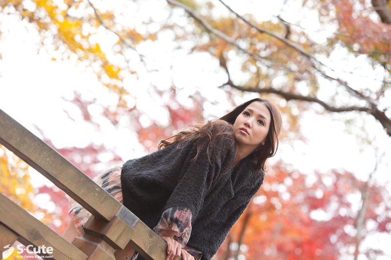 Woman on wooden stairs in autumn