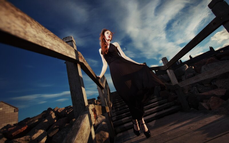 Woman on wooden stairs