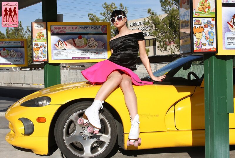 Woman on yellow car with roller skates