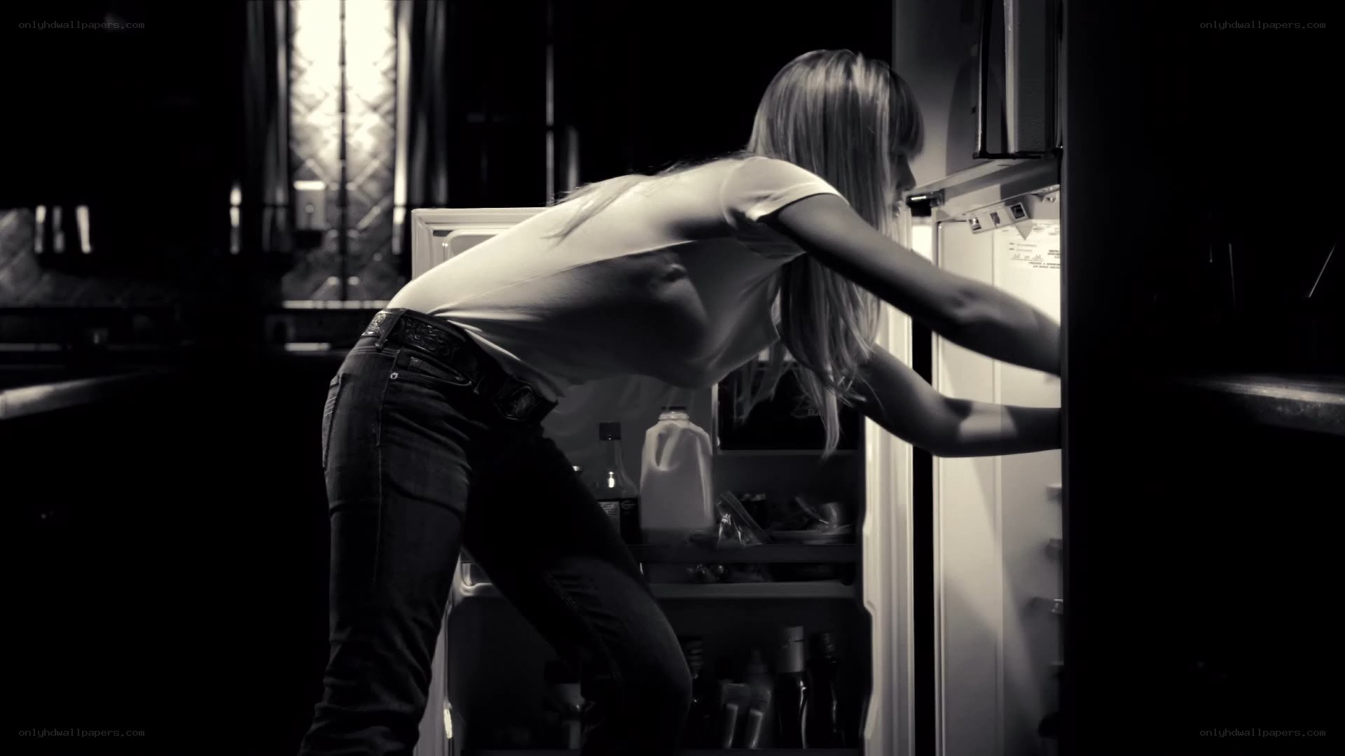 woman opening refrigerator