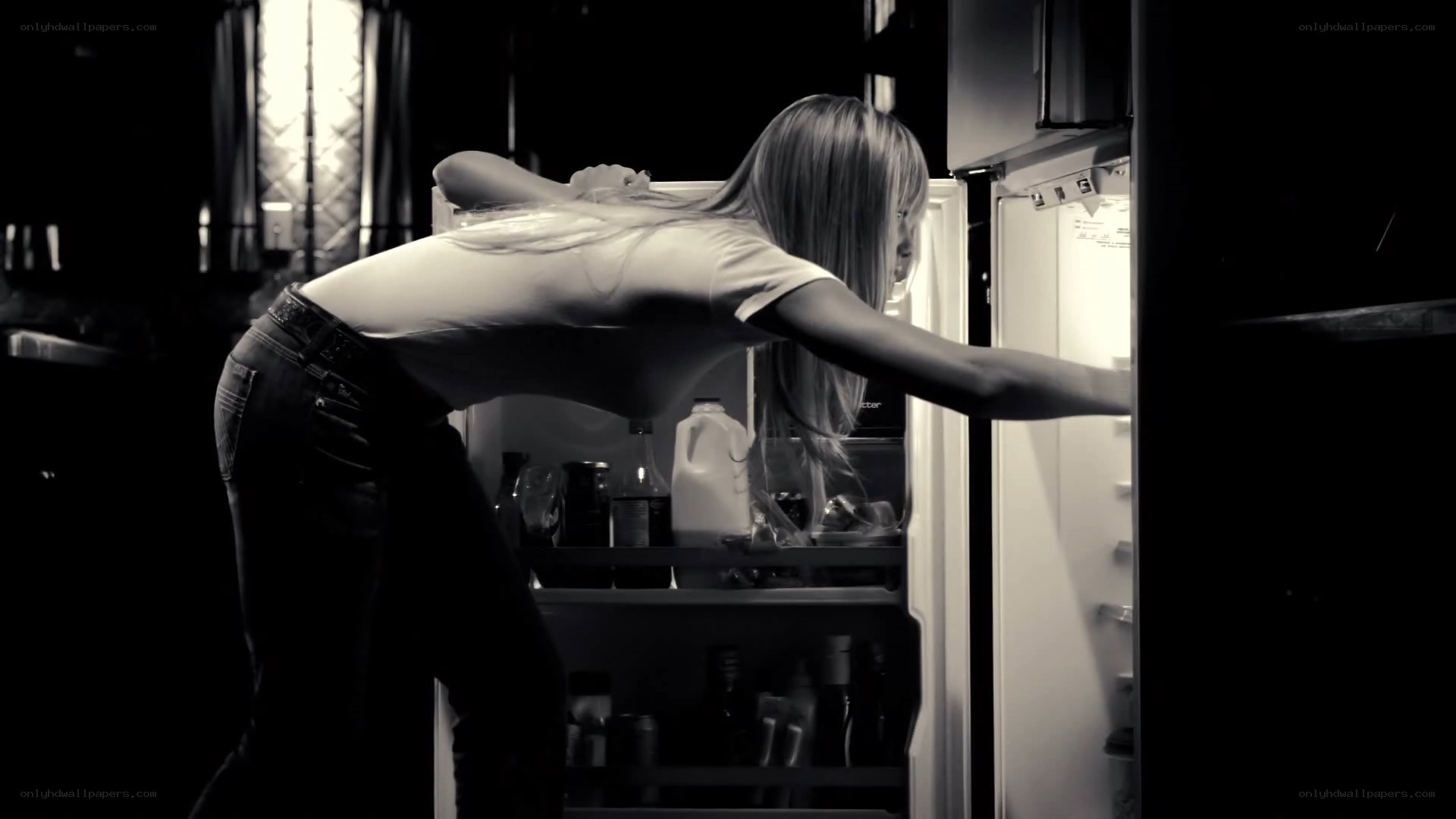 woman opening refrigerator