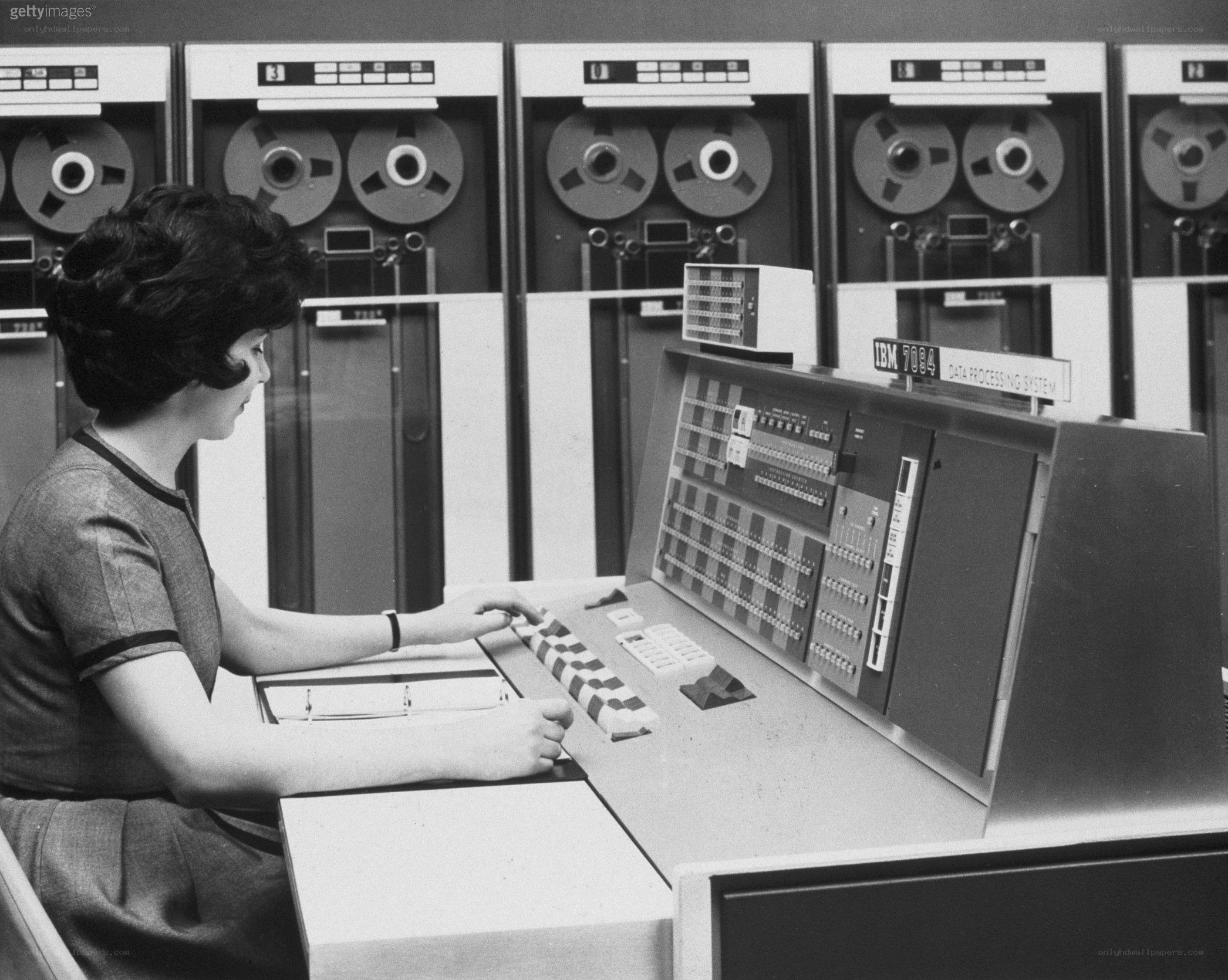 Woman operating IBM 7094 computer