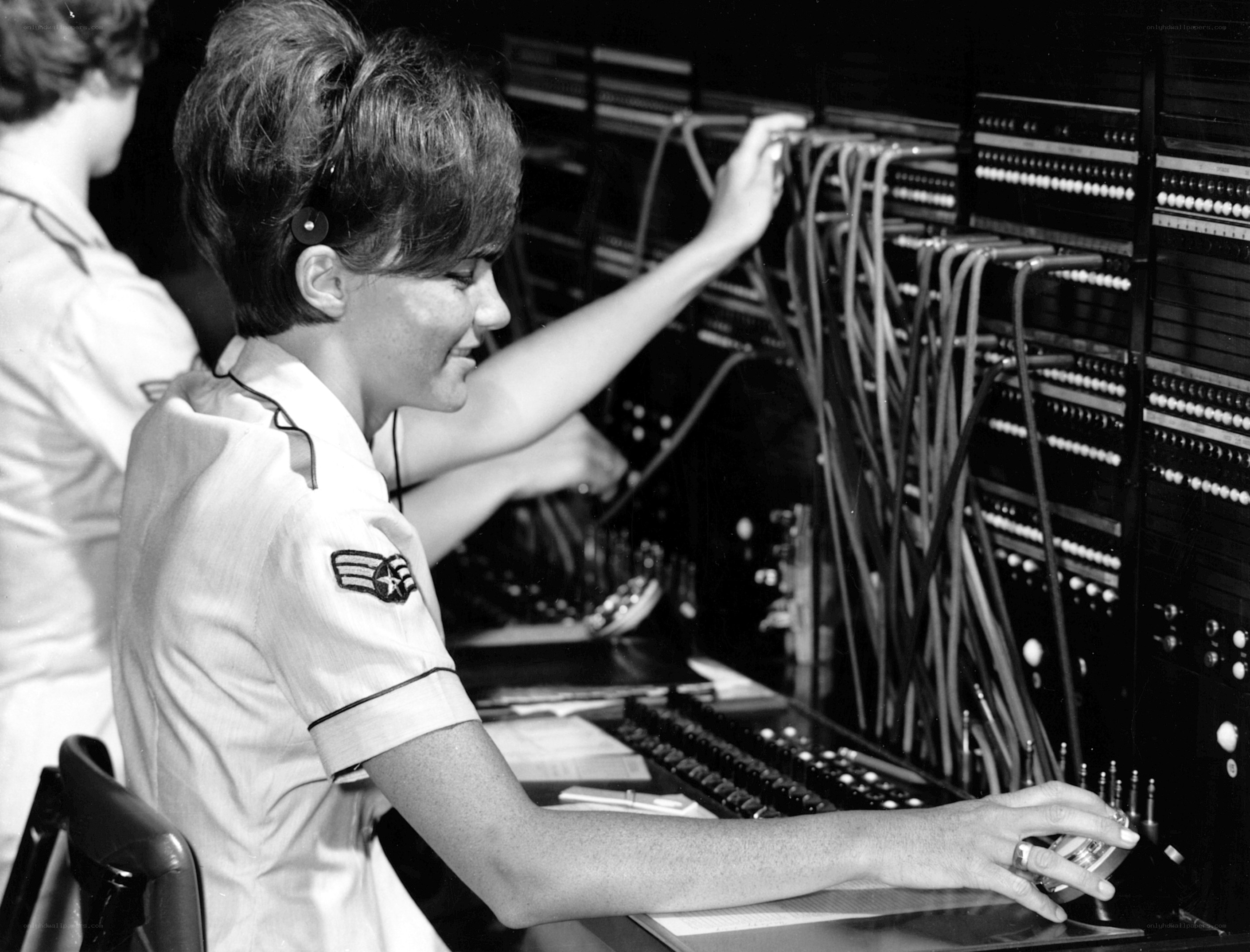 Woman operating telephone switchboard