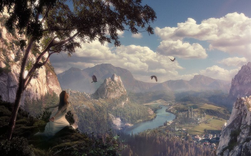 Woman overlooking a fantasy valley