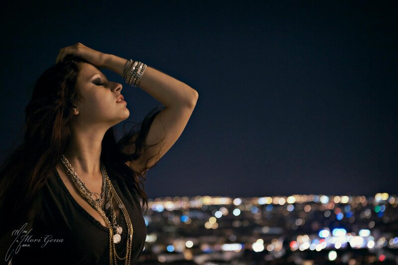 woman overlooking city at night